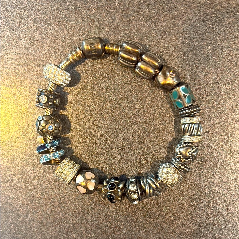 Pandora sterling silver bracelet with 18 charms and spacers
